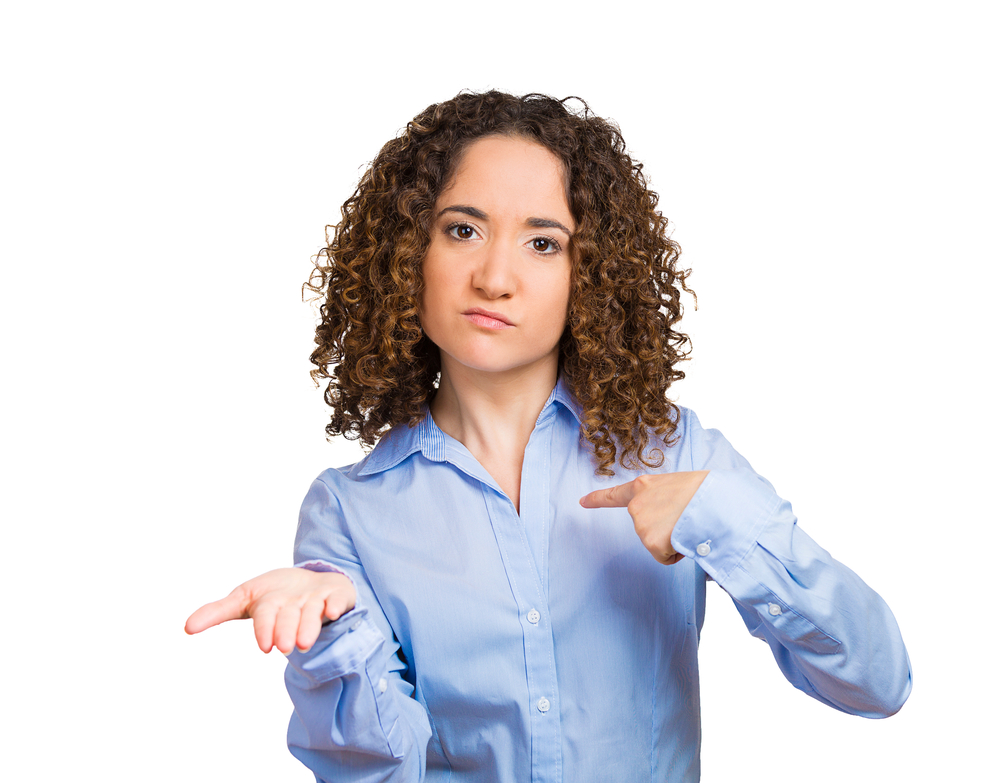 Closeup portrait young angry woman, gesturing with hands palms up, to pay now bills due, isolated white background. Negative human emotion, facial expression, feeling, attitude, reaction body language